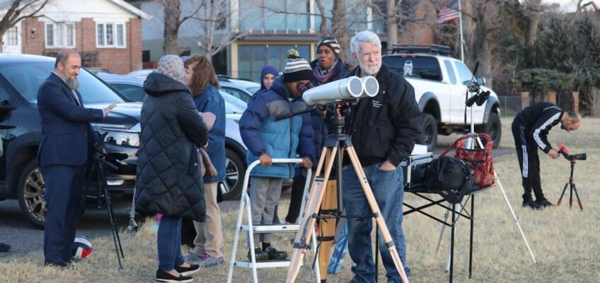 Members of Rocky Mountain Islamic Center with Ron Hranac and his large binoculars with solar filters in place.